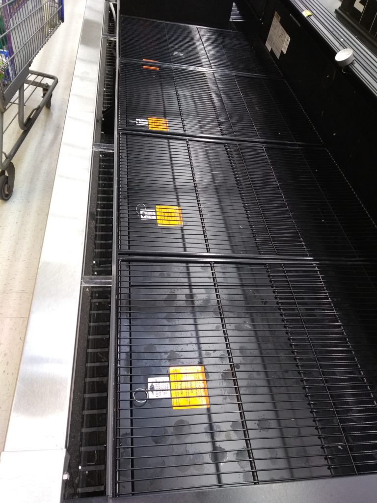 How not to love your neighbor. A picture of empty meat bins.